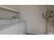 Laundry room featuring washer, dryer, and water heater at 536 S Evergreen Rd, Tempe, AZ 85288