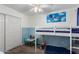 Playful bedroom with fun wall art, a cozy bunk bed, and storage for toys, designed for imaginative adventures at 542 N Orlando Cir, Mesa, AZ 85205