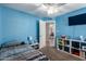 Comfortable bedroom with a ceiling fan, a bookshelf, and a cozy bed, providing a relaxing and stylish retreat at 542 N Orlando Cir, Mesa, AZ 85205