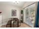 Bright dining area featuring tile floors, a table with bench seating, and natural light at 542 N Orlando Cir, Mesa, AZ 85205