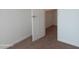 Bedroom with doorway that leads into a walk-in closet; neutral walls and carpeting at 5877 N Granite Reef Rd # 2257, Scottsdale, AZ 85250