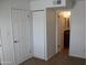 Bedroom with white walls, carpet and access to a bathroom through a door at 5877 N Granite Reef Rd # 2257, Scottsdale, AZ 85250
