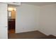 Bedroom with white walls, carpet and access to a bathroom through a door at 5877 N Granite Reef Rd # 2257, Scottsdale, AZ 85250