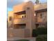 Charming two-story exterior with a balcony, desert landscaping, and warm, inviting architectural details at 5877 N Granite Reef Rd # 2257, Scottsdale, AZ 85250