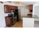 Well-equipped kitchen with stainless steel appliances, dark wood cabinets, and granite countertops at 5877 N Granite Reef Rd # 2257, Scottsdale, AZ 85250