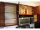 Open kitchen cabinets showcase storage space and a built-in microwave, adding functionality to the design at 5877 N Granite Reef Rd # 2257, Scottsdale, AZ 85250
