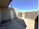 Backyard features a gate, door, and partial patio at 600 S Dobson Rd # 148, Mesa, AZ 85202