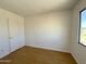 Bedroom features hardwood flooring, a closet, and a window at 600 S Dobson Rd # 148, Mesa, AZ 85202