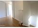 The hallway features wood flooring and a white staircase, complemented by storage cabinets at 600 S Dobson Rd # 148, Mesa, AZ 85202