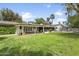 Expansive backyard showcasing well-manicured lawn and mature trees at 613 E Vista Ave, Phoenix, AZ 85020