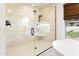 Modern bathroom showcasing walk-in glass shower and stone tiling at 613 E Vista Ave, Phoenix, AZ 85020