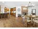 Open concept dining area featuring brick fireplace, wood table and chairs, and modern lighting at 613 E Vista Ave, Phoenix, AZ 85020