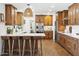 Beautiful kitchen with a breakfast bar, custom cabinetry, and modern appliances creating a stylish and functional space at 613 E Vista Ave, Phoenix, AZ 85020
