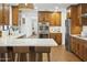 Spacious kitchen features wood cabinets, stainless steel appliances, and white countertops at 613 E Vista Ave, Phoenix, AZ 85020