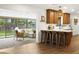 Open concept kitchen and sunroom, featuring a breakfast bar and seamless transition to the outdoor living space at 613 E Vista Ave, Phoenix, AZ 85020