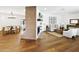 Open concept living room featuring brick fireplace and neutral furniture at 613 E Vista Ave, Phoenix, AZ 85020