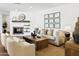 Cozy living room features neutral furniture, wood floors, fireplace and stylish decor at 613 E Vista Ave, Phoenix, AZ 85020