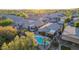 Aerial view of homes with fenced yards, mature trees, private pools, and many with covered patios at 6853 S Russet Sky Way, Gold Canyon, AZ 85118