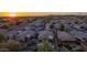 Beautiful aerial view capturing the layout of the residential neighborhood with several houses and green vegetation at 6853 S Russet Sky Way, Gold Canyon, AZ 85118