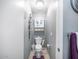Compact half bathroom with a toilet, decorative wall art and lighting at 6853 S Russet Sky Way, Gold Canyon, AZ 85118