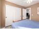 The secondary bedroom boasts a spacious closet, neutral walls, and wood-look flooring at 6853 S Russet Sky Way, Gold Canyon, AZ 85118