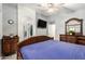 Spacious bedroom featuring a wooden bed frame, bedside tables and decor at 6853 S Russet Sky Way, Gold Canyon, AZ 85118