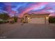 An attractive home exterior exhibiting desert landscaping, a two-car garage, and a well-maintained driveway at 6853 S Russet Sky Way, Gold Canyon, AZ 85118