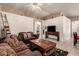 Spacious living room showing tile floors, ceiling fan, TV, and comfortable seating at 6853 S Russet Sky Way, Gold Canyon, AZ 85118