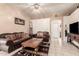 Inviting living room boasts tile floors, ceiling fan, comfortable seating, and stylish decor at 6853 S Russet Sky Way, Gold Canyon, AZ 85118