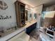 Bathroom featuring vanity storage, soaking tub, and a shower, decorated with a coastal theme at 6960 W Peoria Ave # 212, Peoria, AZ 85345