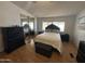 Comfortable bedroom featuring a mirrored closet, neutral colors, and natural light at 6960 W Peoria Ave # 212, Peoria, AZ 85345