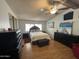 Bright bedroom offering a ceiling fan, bright space, and ample storage space at 6960 W Peoria Ave # 212, Peoria, AZ 85345