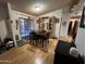 Cozy dining area featuring a table with seating for four and sliding glass door to the exterior at 6960 W Peoria Ave # 212, Peoria, AZ 85345