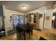 Cozy dining area with wood table and chairs, sliding door, and built in cabinet at 6960 W Peoria Ave # 212, Peoria, AZ 85345