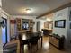 Dining room featuring dark wood table set and built-in display cabinet at 6960 W Peoria Ave # 212, Peoria, AZ 85345
