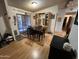 Bright dining room featuring patio access, wood laminate flooring, and a built-in buffet at 6960 W Peoria Ave # 212, Peoria, AZ 85345
