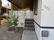 Stairway and covered porch featuring desert landscaping and privacy lattice at 6960 W Peoria Ave # 212, Peoria, AZ 85345