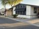 Charming home featuring desert landscaping and a covered parking area at 6960 W Peoria Ave # 212, Peoria, AZ 85345