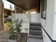 The exterior view includes steps and a covered porch, with a garden bed adding curb appeal at 6960 W Peoria Ave # 212, Peoria, AZ 85345