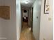 Inviting hallway featuring hardwood floors and neutral walls leads to the living areas of the home at 6960 W Peoria Ave # 212, Peoria, AZ 85345