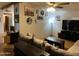 Inviting living room featuring wood-look flooring, a ceiling fan, and stylish decor at 6960 W Peoria Ave # 212, Peoria, AZ 85345