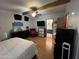 Bright main bedroom with wood beam, and adjacent bathroom, creating a relaxing retreat at 6960 W Peoria Ave # 212, Peoria, AZ 85345