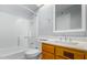 Clean bathroom with a white tiled shower, vanity and sink, and modern fixtures at 700 E Mesquite Cir # N125, Tempe, AZ 85288