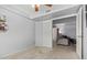 View into a light and airy bedroom with neutral carpet and paint at 700 E Mesquite Cir # N125, Tempe, AZ 85288