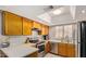 Bright kitchen with stainless steel appliances, a skylight, and generous counter space for cooking at 700 E Mesquite Cir # N125, Tempe, AZ 85288