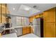 Well-lit kitchen featuring stainless steel appliances, ample counter space, and modern fixtures for easy meal prep at 700 E Mesquite Cir # N125, Tempe, AZ 85288
