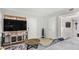 The living room features a rustic console, large screen TV, and comfortable seating for relaxing and entertaining at 700 E Mesquite Cir # N125, Tempe, AZ 85288