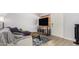 Bright living room with hardwood floors, large TV, and plenty of natural light at 700 E Mesquite Cir # N125, Tempe, AZ 85288