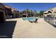 Inviting community pool with lounge chairs, perfect for relaxation and enjoyment at 700 E Mesquite Cir # N125, Tempe, AZ 85288