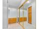 Spacious walk in closet with mirrors and storage drawers, leading to bathroom sink area at 700 E Mesquite Cir # N125, Tempe, AZ 85288